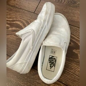 Woman’s white checkered Vans